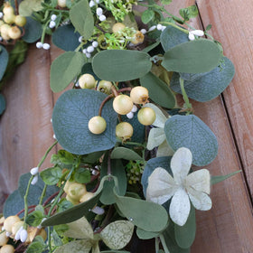 Bibelot realistic foliage and berries create year-round beauty.