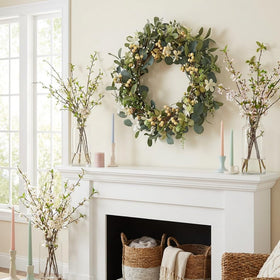 Bibelot eucalyptus berry wreath on door adds spring charm.