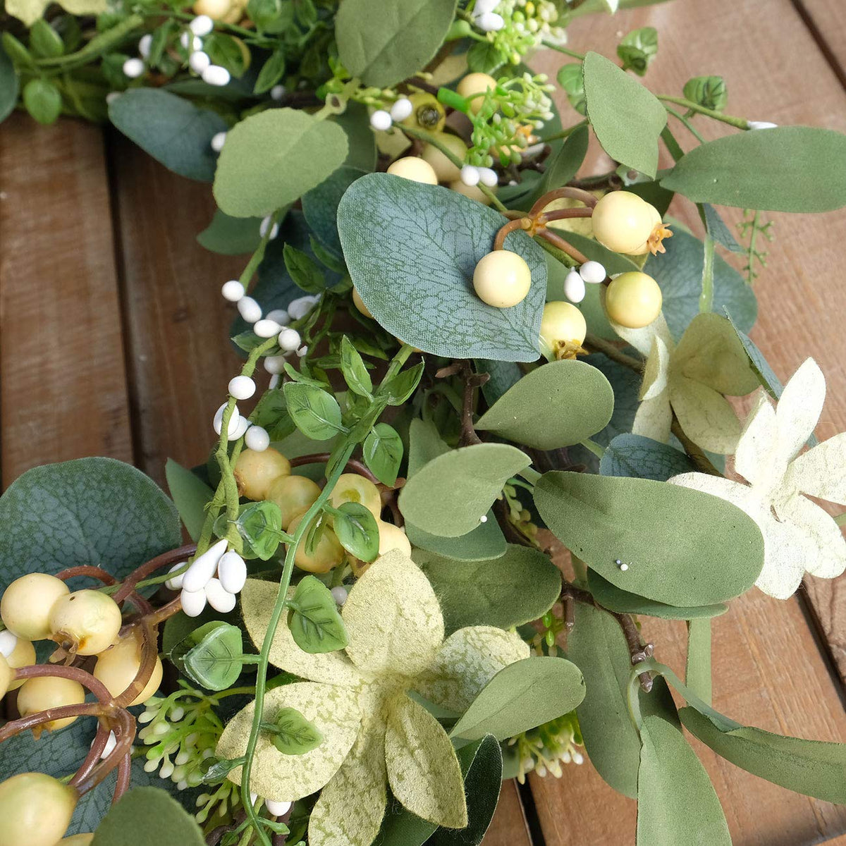 Bibelot indoor/outdoor wreath preserves color in covered spaces.