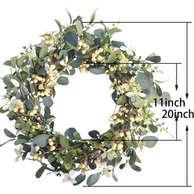 Bibelot wreath with iron-ring base for durable hanging.