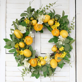 Bibelot lemon-peony-hydrangea wreath showcases vibrant flowers for year-round decor.