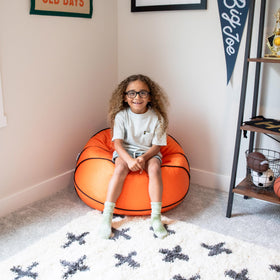 Big Joe sports ball bean bag chair includes double stitching for safety and durability.