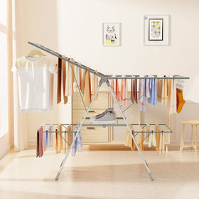 Dimensions of Bigzzia rack 56.1 by 22.7 inches beside a washer