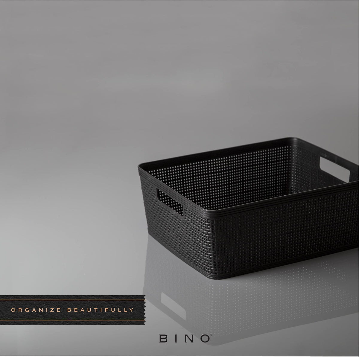 BINO woven plastic basket medium black under the sink setup for compact storage.