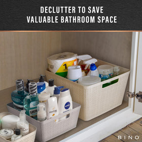 BINO woven plastic basket fits under-sink spaces for organized cleaning supplies.