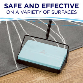 Open dual dust bins demonstrate easy, mess-free disposal.