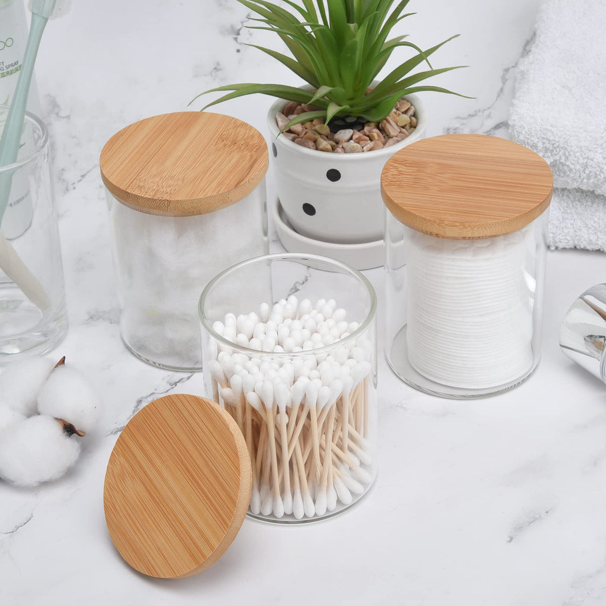 BKYFPQ glass canister set keeps cotton balls neatly visible and accessible.