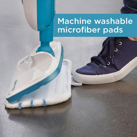 BLACK+DECKER Steam Mop reaching under furniture with swivel head