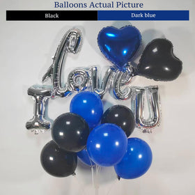 BlissBash silver I LOVE YOU letters add a modern touch to hotel room decor.