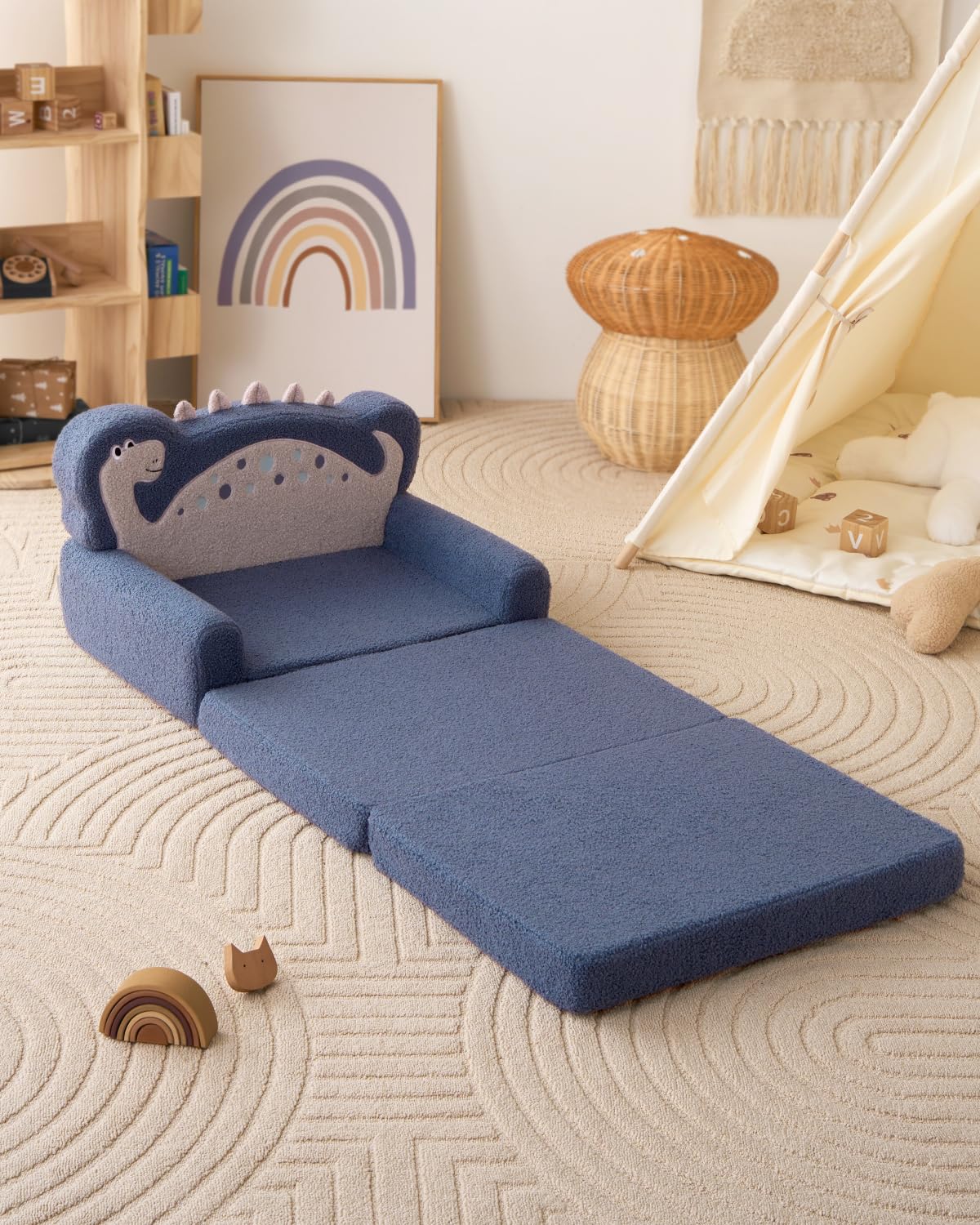 Blue dinosaur play couch suits playrooms and travel-friendly seating.