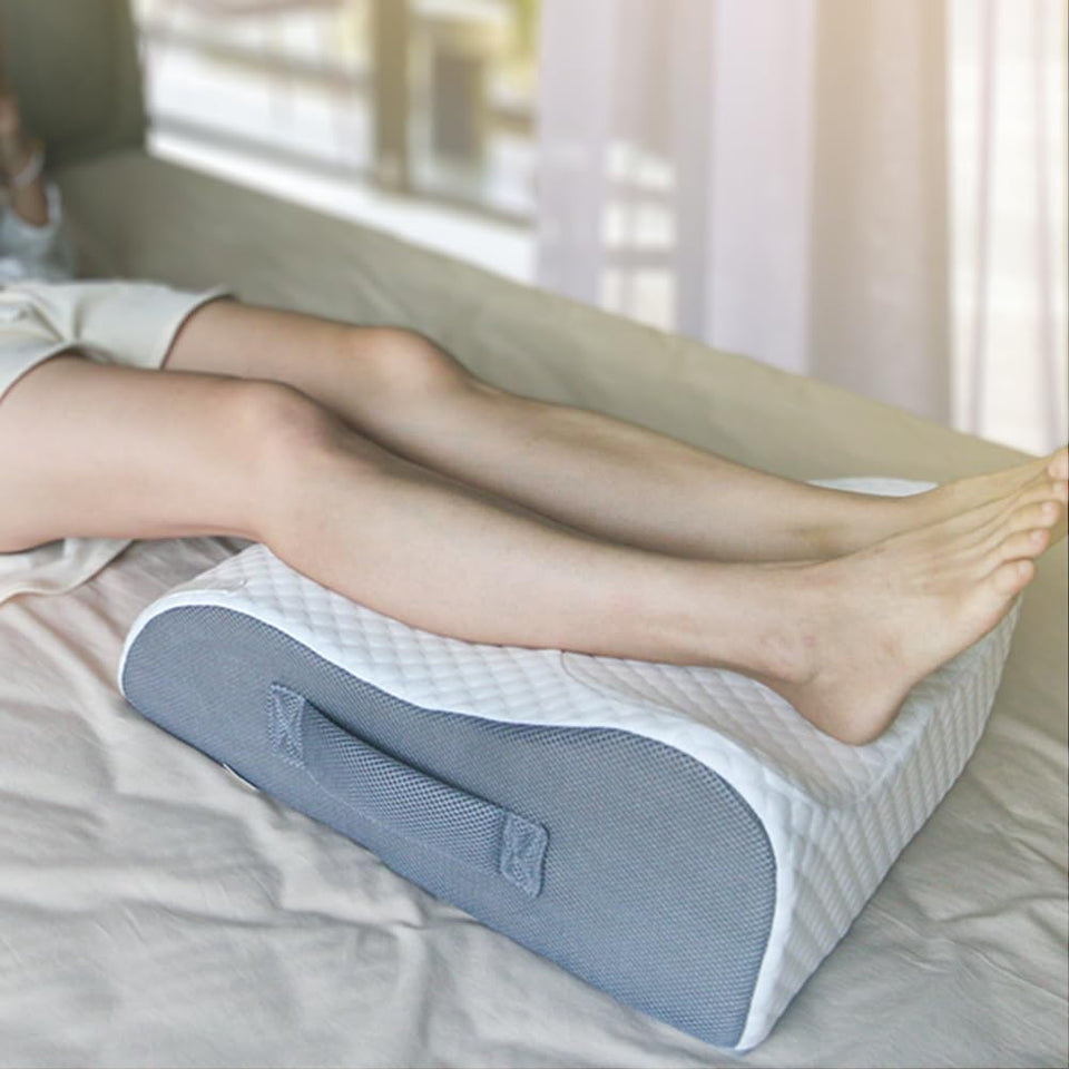 BlissfulNest leg elevating pillow on bed for comfortable leg elevation after surgery