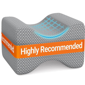 BlissTrends memory foam knee pillow on bed offering side-sleeper support for spine alignment.
