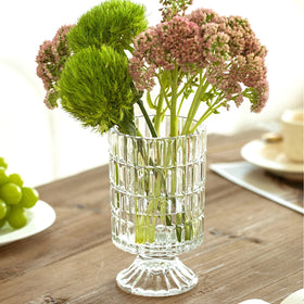 BLOFLO STU candle-ready glass vase complements cozy tablescapes.