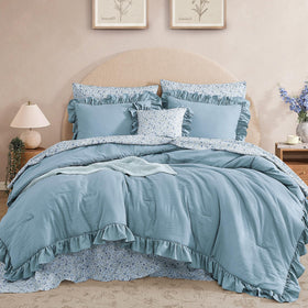 Bloomhaven queen comforter set with blue ruffles adds elegant texture to your bed.
