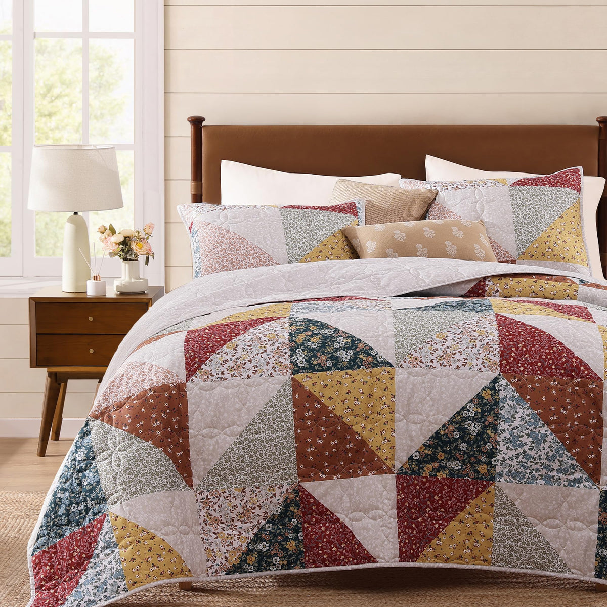 BLOOMHAVEN quilt set with patchwork design adds timeless charm to your bedroom.