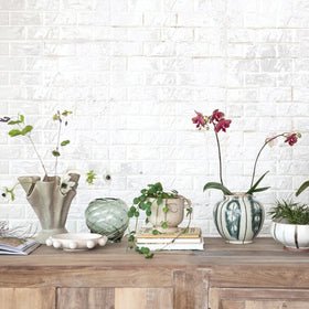 Bloomingville cream bowl with orb accents pairs with other serveware for cohesive styling.