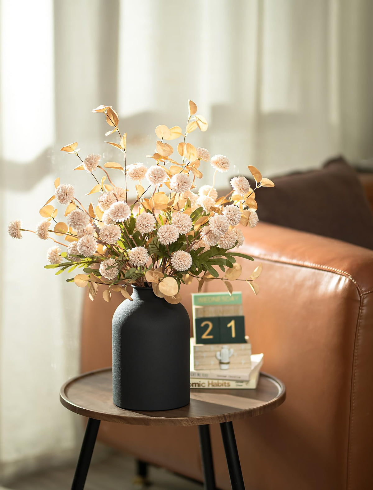 BLOSMON matte black metal vase provides modern centerpiece foundation