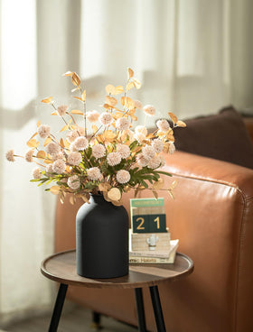 BLOSMON matte black metal vase provides modern centerpiece foundation