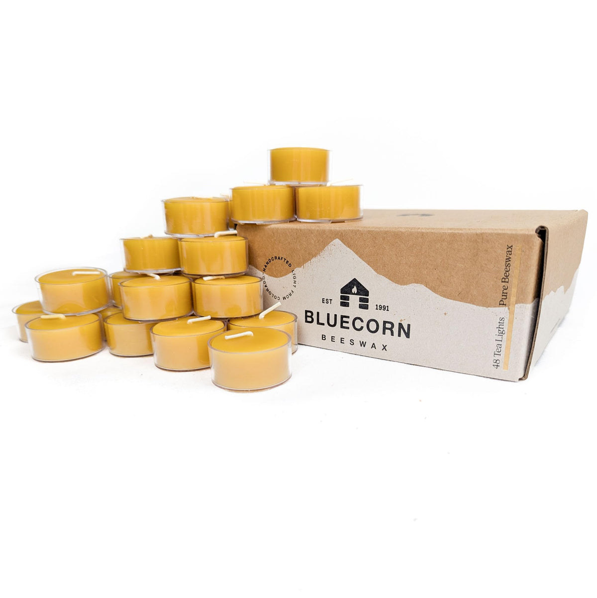 Bluecorn tea light candle with amber glow for warm ambiance.