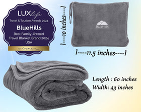 BlueHills blanket clipped to a backpack with carabiner for on-the-go comfort