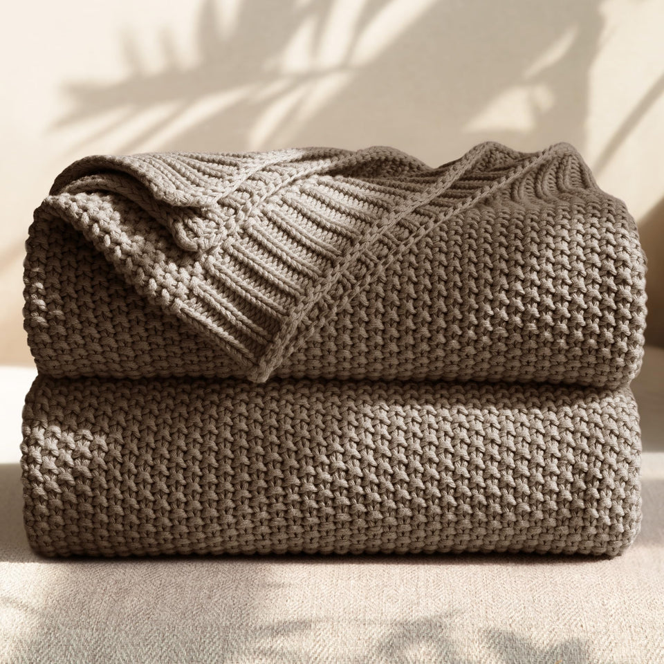 blunique 100% cotton cable knit throw on sofa for cozy warmth.