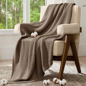 blunique throw shown as a light, breathable comfort option.