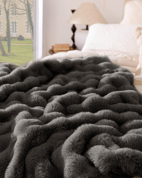 Decorative Blunique blanket draped over a chair enhances living space