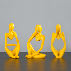 Abstract art sculpture in yellow resin elevates living room ambiance.
