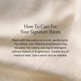 BOLL & BRANCH Signature Hemmed Sheet Set on a white bed for a calm look