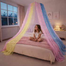 Bollepo bed canopy with glowing stars over rainbow netting for a magical princess sleep space