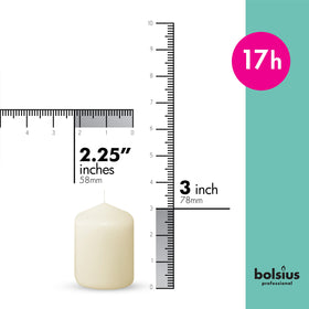 Bolsius Ivory pillar candles 2.3x3 inch in a 12-pack arranged for a dinner centerpiece.