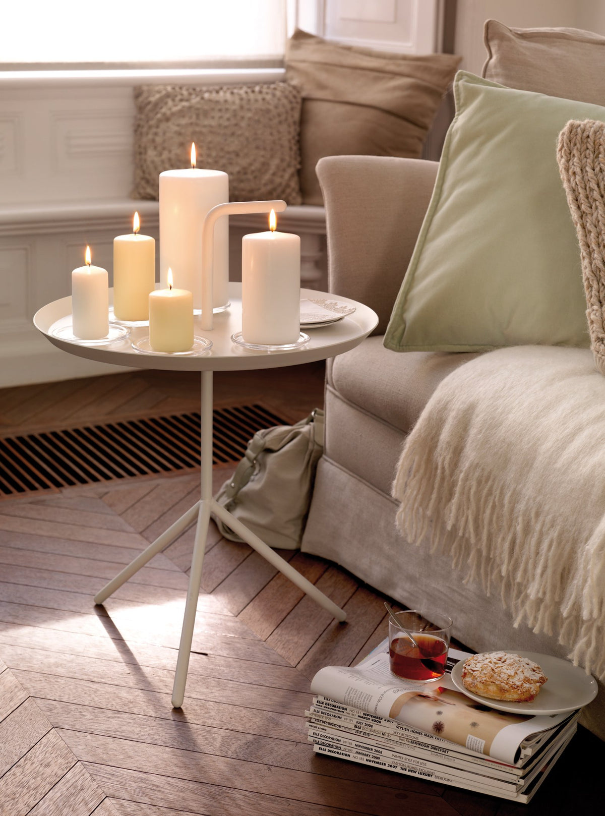 Bolsius Ivory pillar candles on a dinner table for candlelit ambiance.