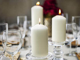 Bolsius ivory pillar candles offer easy relighting and steady burn for events.