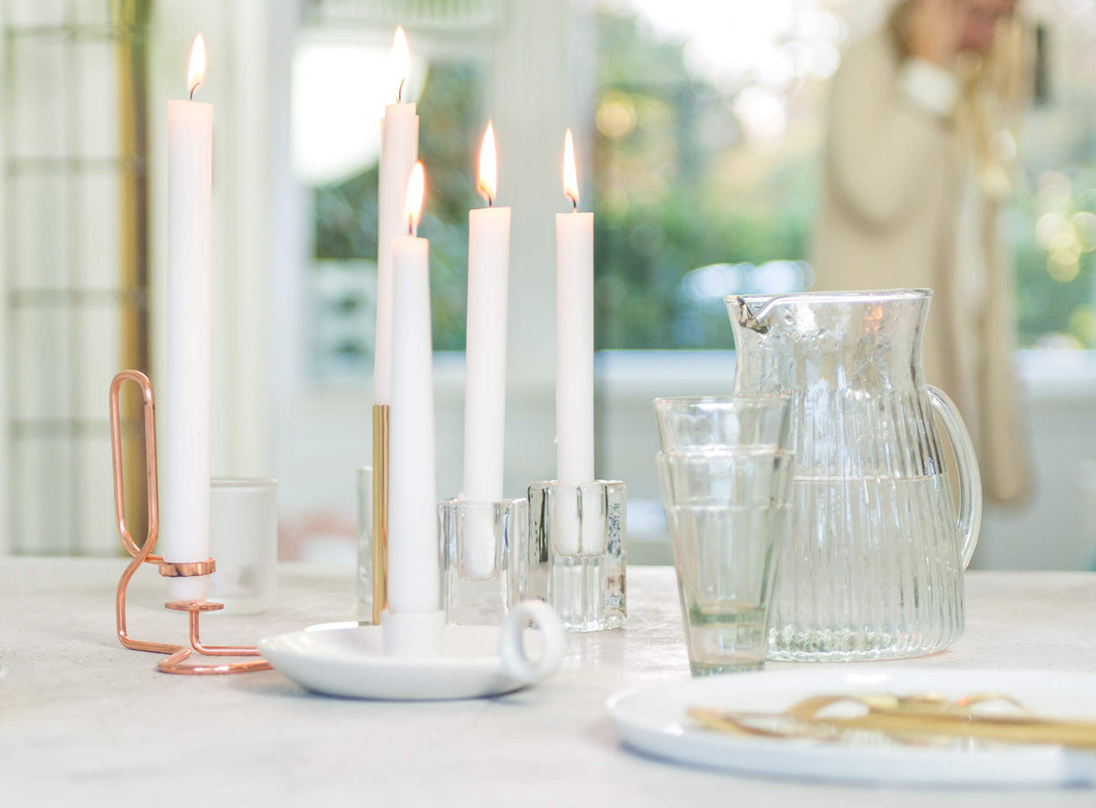 Bolsius white taper candles fit standard holders and centerpieces.