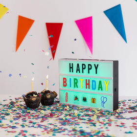 BONNYCO cinema light box showing letters and emojis for creative messages.
