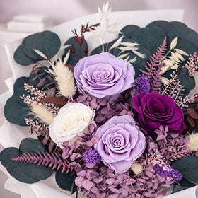 Bonsion elegant purple rose arrangement suitable for mom’s desk or bedside table.