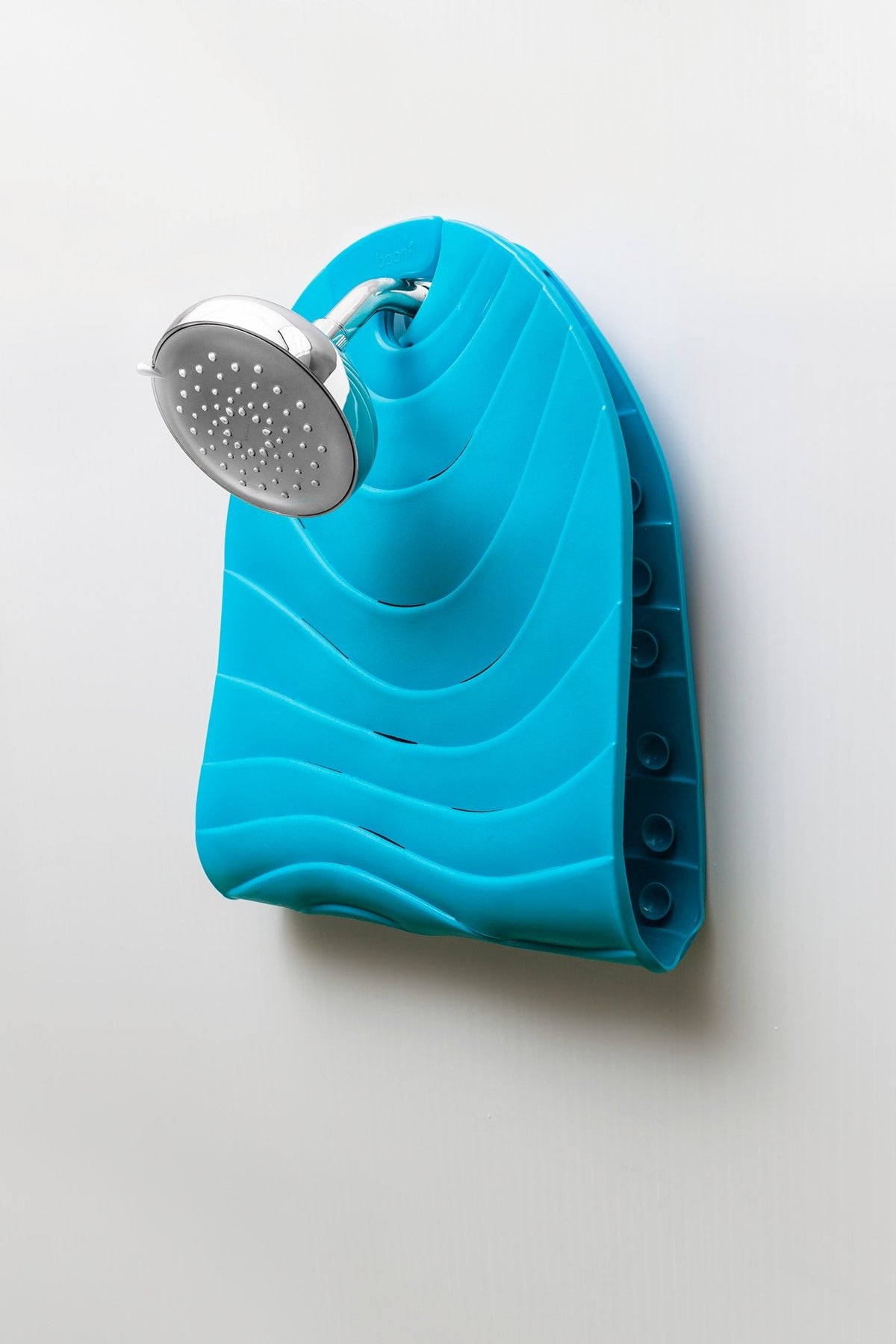 Boon Ripple blue mat covers a large tub area for bath time.