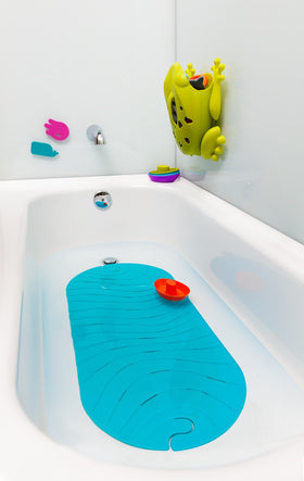 Boon Ripple mat folds for easy hanging and storage.