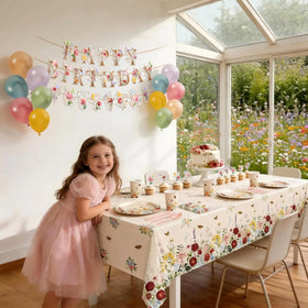 BORAMDO wildflower banner and balloons create a whimsical backdrop for photos.