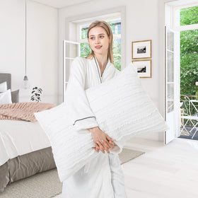 Bosowos tassel-detail pillow sham adds farmhouse charm to any bed.