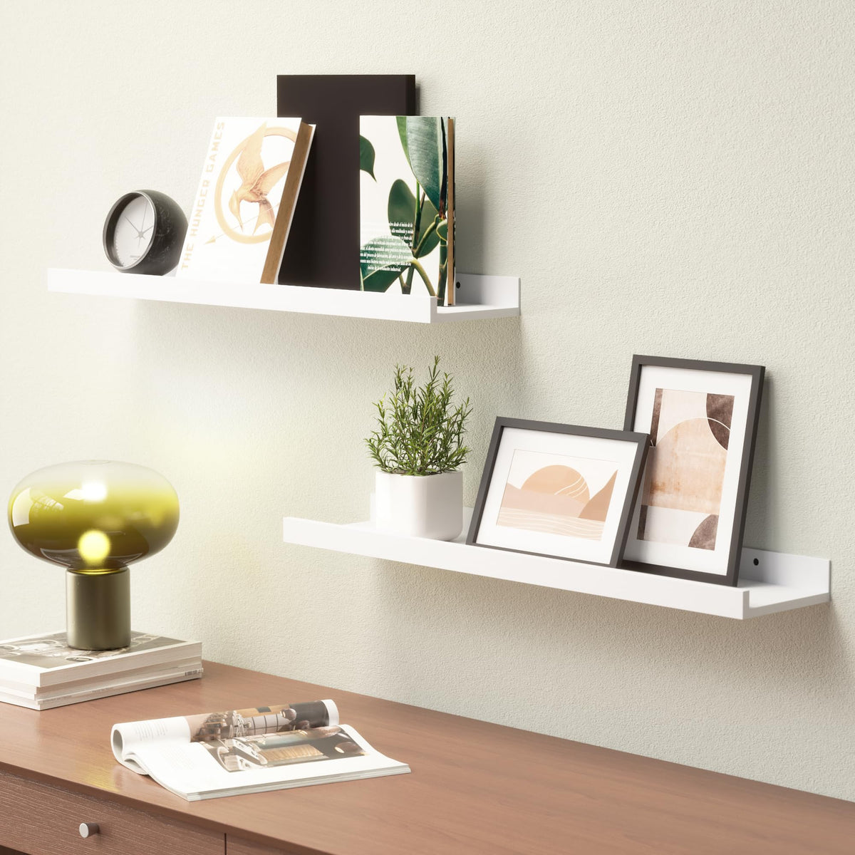 Boswillon floating shelves decorating living room with framed photos.