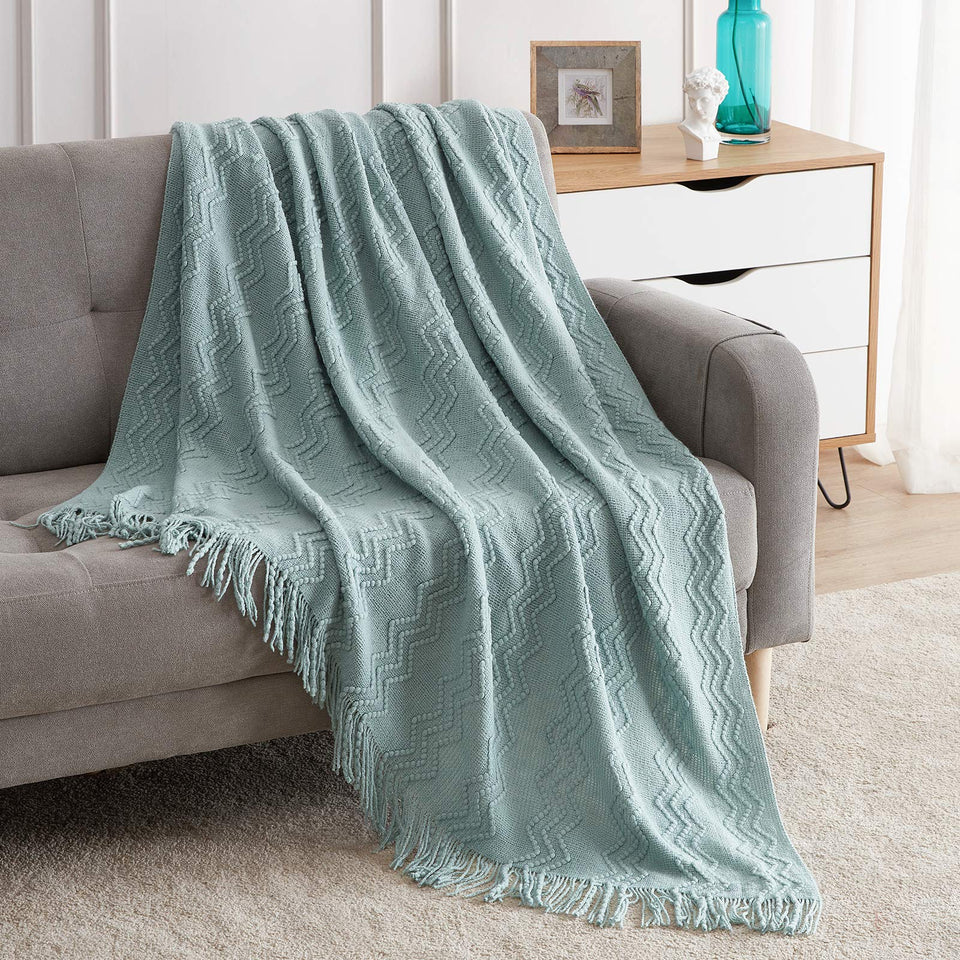 BOURINA Aqua Throw blanket in 50x60 inches laid on a sofa for versatile coverage