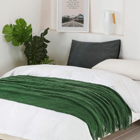 BOURINA knit textured pattern blanket adds tactile decor to room.