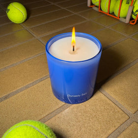 Boy Smells Dynasty Salt sits in a blue glass tumbler for refined decor
