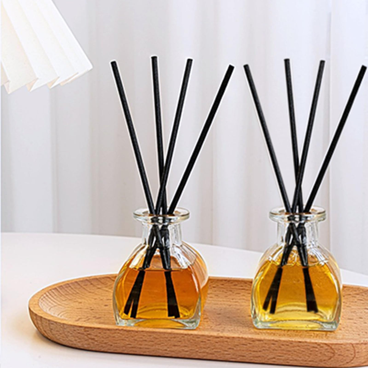 Brajttt vintage glass vases with patterned surface catch light.