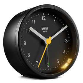 Braun Classic analogue alarm clock dial close-up for easy at-a-glance reading.