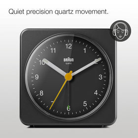 Braun clock's yellow second hand adds quick visibility during night checks.