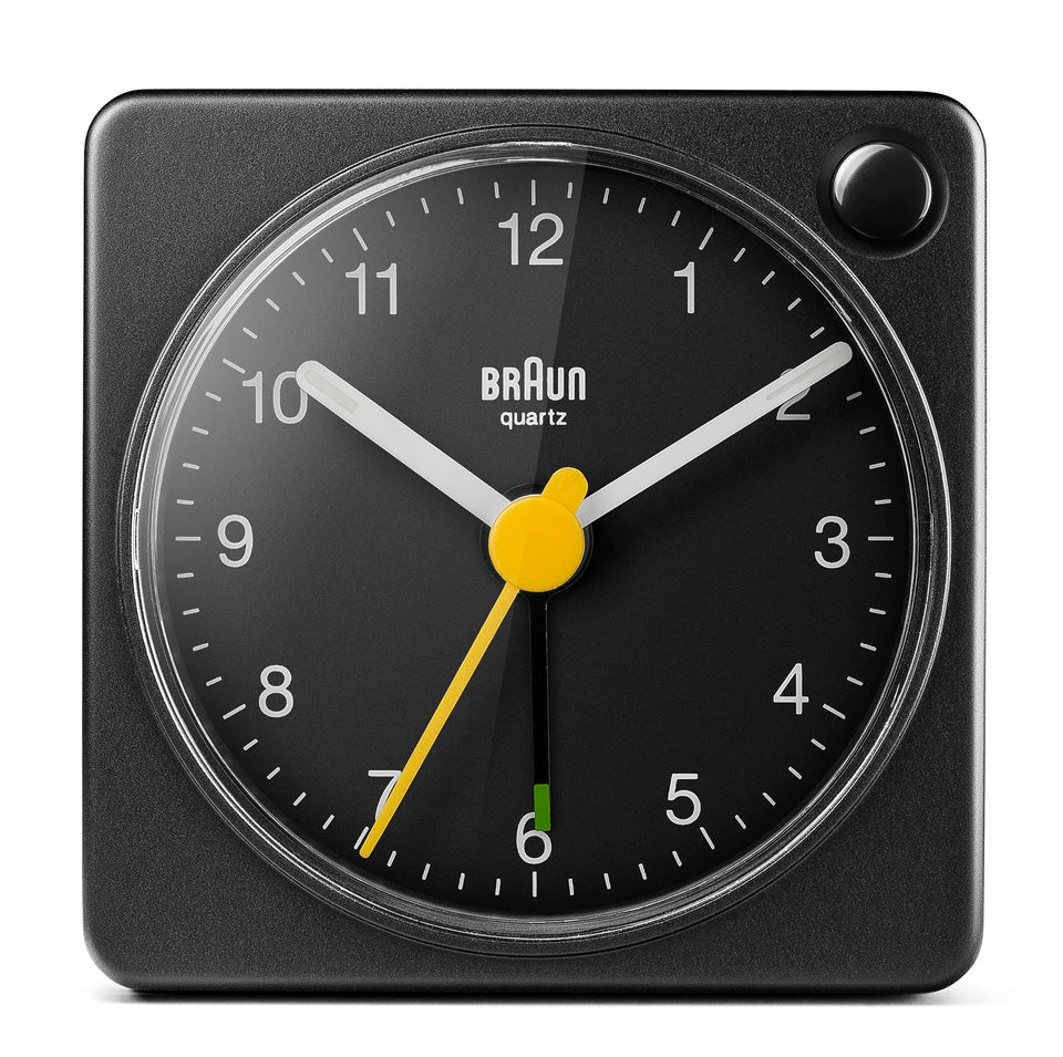 Braun classic travel alarm clock face with clear dial and luminous hands for easy viewing