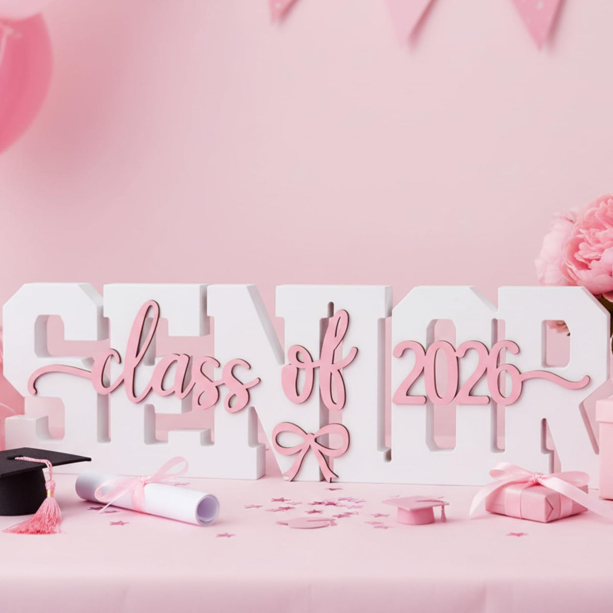 BreezeHug coquette bow 2026 sign as a focal piece for graduation parties