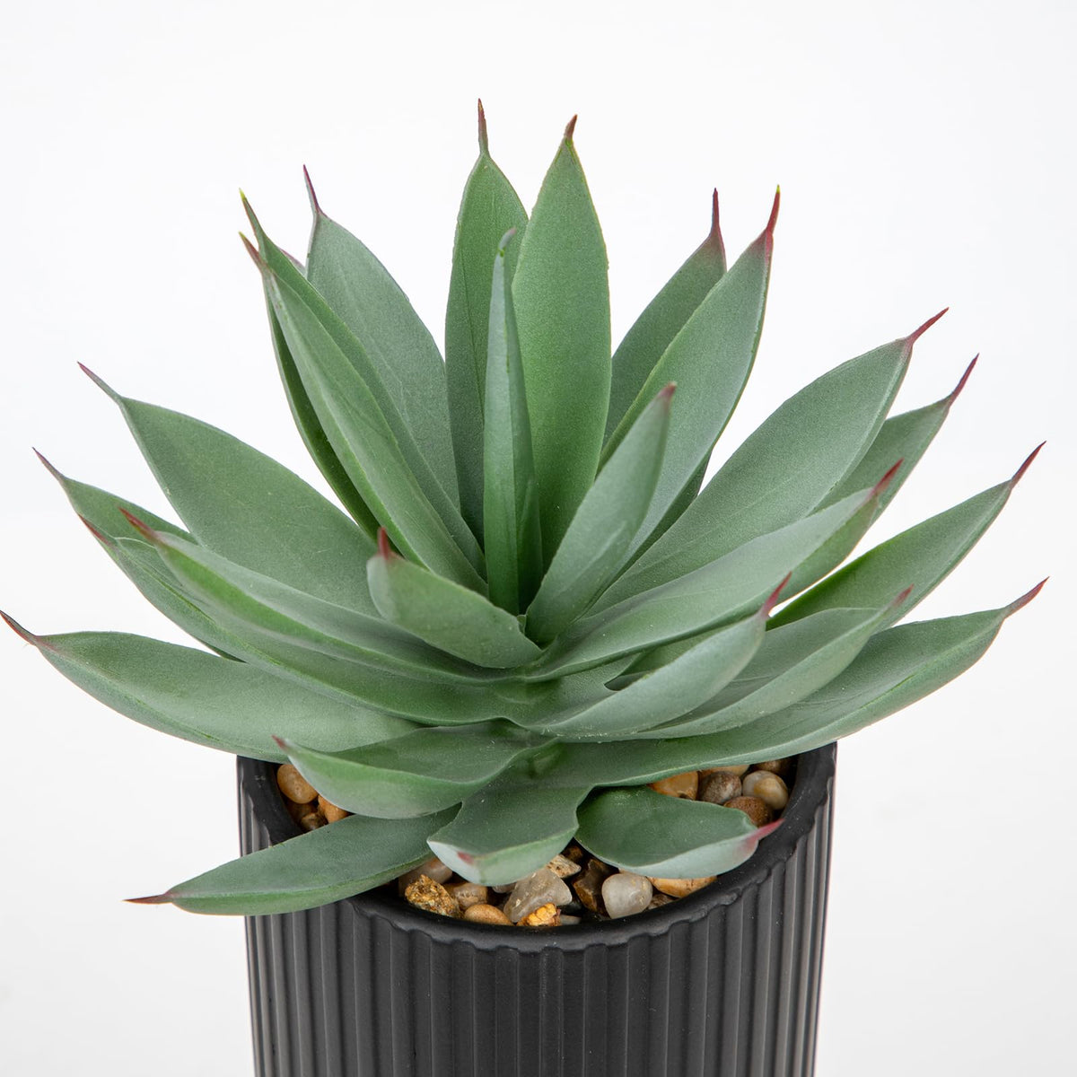 Briful faux succulents on living room mantel create cozy ambiance.